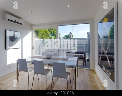 Dining table and chairs in modern dining room, Eastbourne St, Melbourne Stock Photo