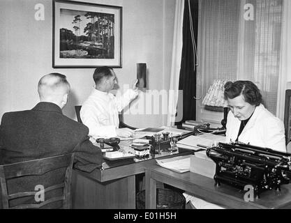 Physician interpreting a radiograph, 1943 Stock Photo