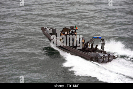 US Navy SEAL team members with Naval Special Warfare Group 10 and Nigerian sailors with the Special Boat Service, Cameroonian soldiers with the Rapid Intervention Battalion and Dutch marines with the Maritime Special Operations Forces operate in a rigid-hull inflatable boat during Obangame Express training exercise April 20, 2014 in the Gulf of Guinea. Stock Photo