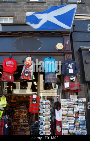 Saltire flag flying outside the front of a Scottish Souvenir shop, Edinburgh. Stock Photo