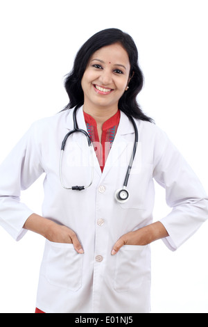 Happy young female doctor against white background Stock Photo