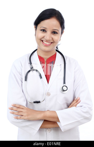 Happy young female doctor against white background Stock Photo