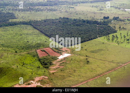Belem to Maraba, Brazil. Aerial view of a patch of forest surrounded by farm land deforested for cattle pasture. Stock Photo
