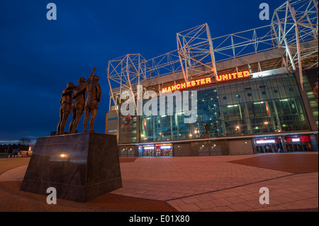 Manchester United football ground at night Manchester UK Stock Photo