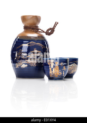 Japanese souvenir sake set, bottle tokkuri and cups ochoko isolated on white background Stock Photo