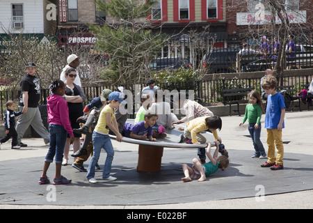 Children play & have fun together at the Vanderbilt Playground in Prospect Park, Brooklyn, NY. Stock Photo
