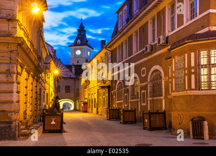 Brasov, Romania. Saxon medieval architecture in twilight view, Transylvania landmark. Enescu Square and Council House Stock Photo