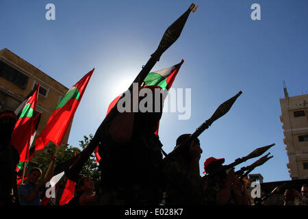 Gaza. 29th Apr, 2014. Palestinian militants from the Popular Front for the Liberation of Palestine (PFLP) take part in a military parade in the southern Gaza Strip City of Khan Yunis on April 29, 2014. Credit:  Khaled Omar/Xinhua/Alamy Live News Stock Photo