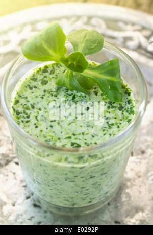 Field salad yogurt Smoothie in glass on silver Stock Photo