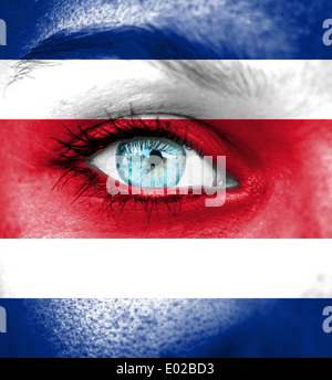 Woman face painted with flag of Costa Rica Stock Photo