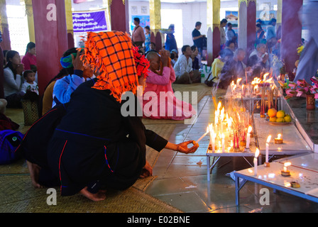 Pa-o women coming to pay homage to the importance Buddha images during the festival. Stock Photo