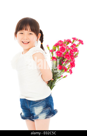 Smiling girl hiding a bouquet of carnations Stock Photo