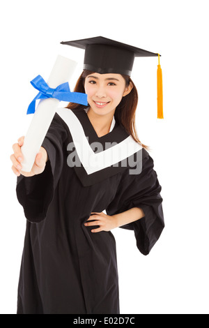 young woman college graduate wearing cap and gown holding diploma Stock Photo