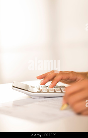 Female finger desk indoor white bill invoice Stock Photo