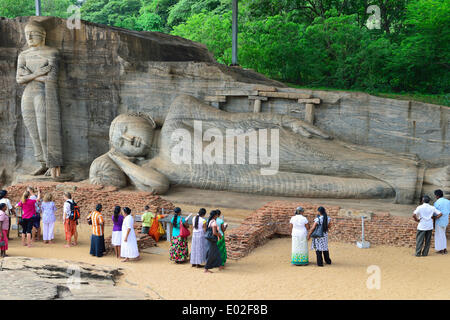 Tourists in front of a lying and a standing Buddha statue, Gal Vihara, UNESCO World Heritage Site, Polonnaruwa Stock Photo