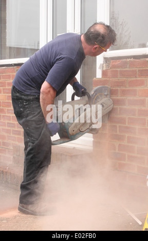 A window fitter using a disc cutter Stock Photo