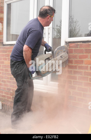 A window fitter using a disc cutter Stock Photo
