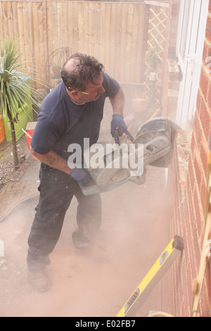 A window fitter using a disc cutter Stock Photo