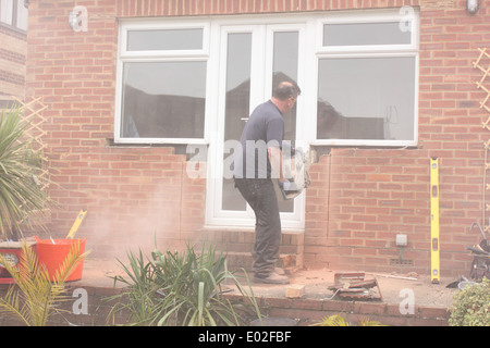A window fitter using a disc cutter Stock Photo