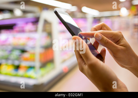 Female store cell phone close-up Stock Photo