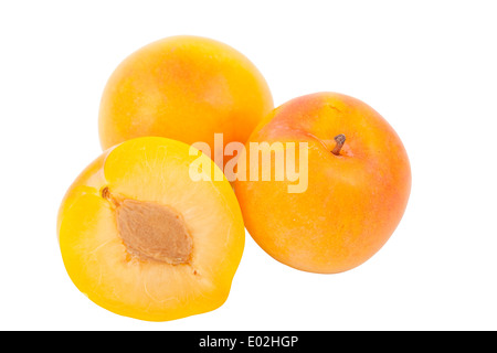 two whole yellow plum on white background Stock Photo
