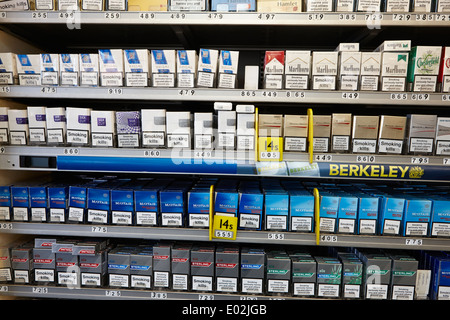 tobacco products uncovered in a cigarette cabinet in a small store northern ireland Stock Photo