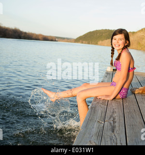 Beautiful teenage girl in lingerie relaxing on the wooden post on the sea  coast Stock Photo by ©zefart 18938223