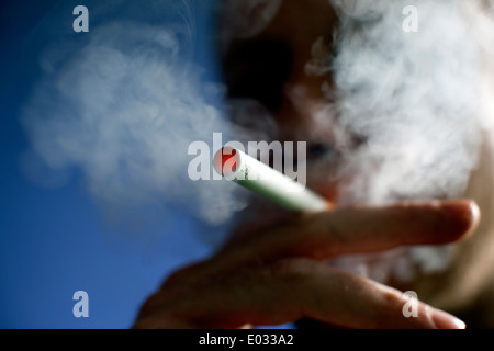 Man smoking a Puritane disposable e-cigarette, London MODEL RELEASED Stock Photo
