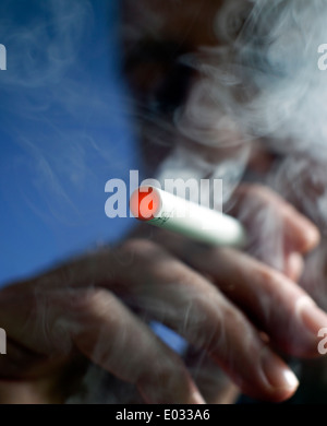 Man smoking a Puritane disposable e-cigarette, London MODEL RELEASED Stock Photo
