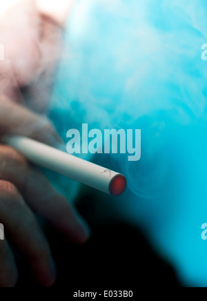 Man smoking a Puritane disposable e-cigarette, London MODEL RELEASED Stock Photo