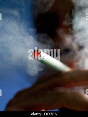 Man smoking a Puritane disposable e-cigarette, London MODEL RELEASED Stock Photo