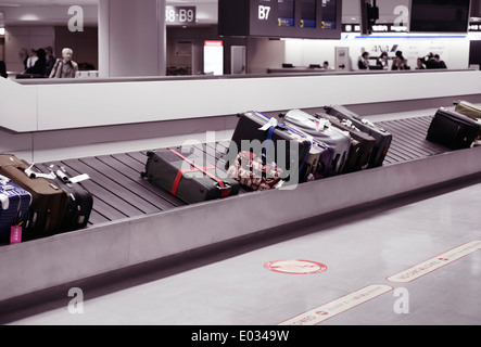 Suitcases, luggage on airport baggage claim conveyor carousel, Narita International Airport, Japan Stock Photo