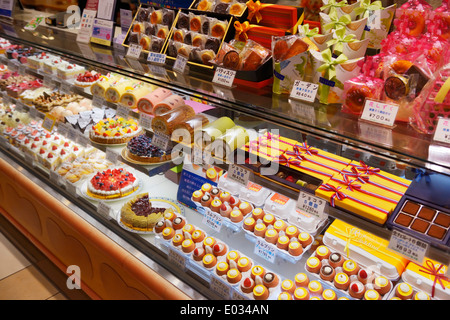 Cakes, rolls and pastries on a display at a Japanese bakery. Tokyo, Japan. Stock Photo