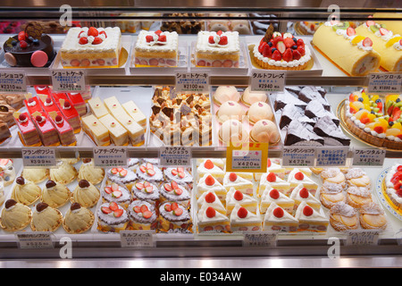 Cakes and pastries on a display at a Japanese bakery. Tokyo, Japan. Stock Photo