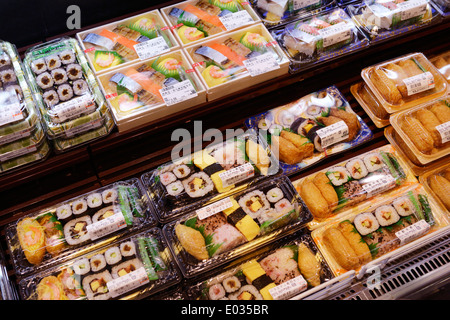 Packaged sushi rolls, prepared food on display in a Japanese supermarket. Tokyo, Japan.