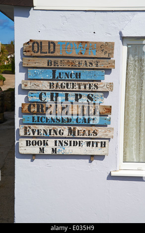signs on wall of Old Town Cafe, St Marys, Isles of Scilly, Scillies, Cornwall in April Stock Photo