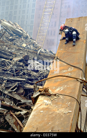 Urban Search and Rescue workers continue the recovery of victims amongst the wreckage of the World Trade Center in the aftermath of a massive terrorist attack which destroyed the twin towers killing 2,606 people September 21, 2001 in New York, NY. Stock Photo
