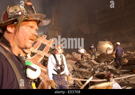 Urban Search and Rescue workers continue the recovery of victims amongst the wreckage of the World Trade Center in the aftermath of a massive terrorist attack which destroyed the twin towers killing 2,606 people September 19, 2001 in New York, NY. Stock Photo