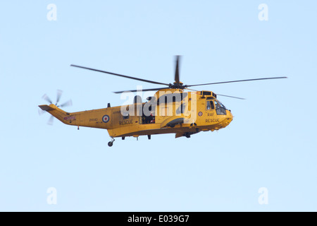 Seaking coastguard rescue helicopter on a training mission off of Mersea Island, Essex. Stock Photo