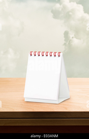 Blank desk calendar at wooden table, copy space for your design. Stock Photo