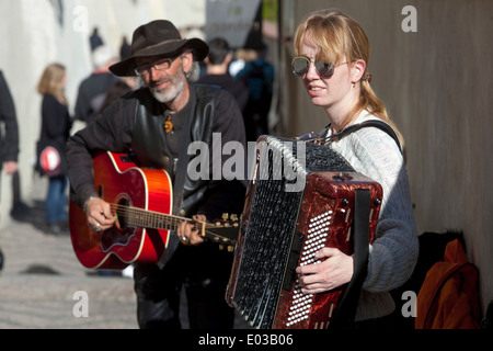 Prague street musician performers playing on the touristic road Prague tourism Prague street musicians Prague buskers Prague musicians Stock Photo