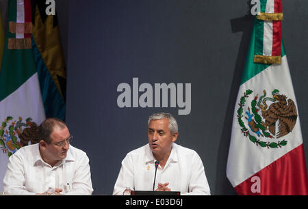 Merida, Mexico. 30th Apr, 2014. The President of Guatemala Otto Perez Molina (R) delivers a speech during the opening ceremony of the sixth Association of Caribbean States Summit in Merida, Yucatan, Mexico, on April 30, 2014. © Rong Hao/Xinhua/Alamy Live News Stock Photo