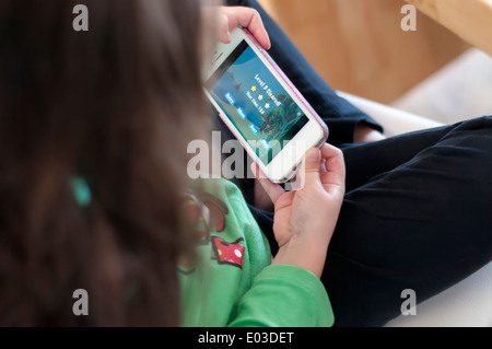 Child playing games on phone Stock Photo