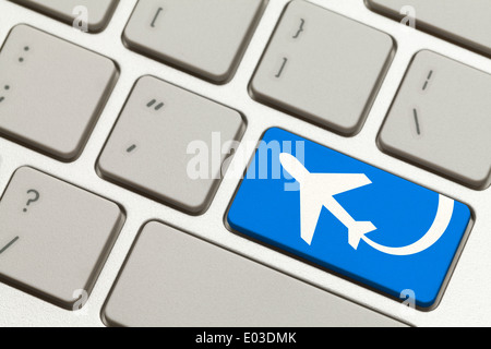 Close Up of Blue Key with Airplane on Keyboard. Stock Photo