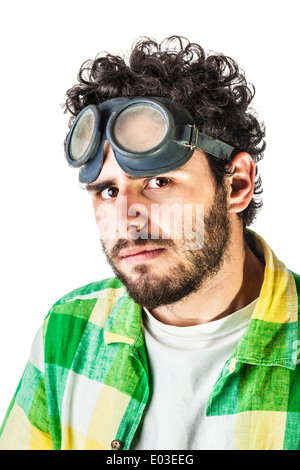 a guy wearing casual clothes and on old pair of goggles over a white background and looking at the camera Stock Photo