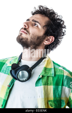 a guy wearing casual clothes and on old pair of goggles over a white background Stock Photo