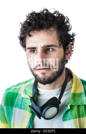 a guy wearing casual clothes and on old pair of goggles over a white background Stock Photo