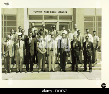 This glossy photo features NASA personnel, including engineers ...