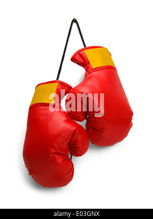 Pair of Red Boxing Gloves Hanging Isolated on White Background. Stock Photo