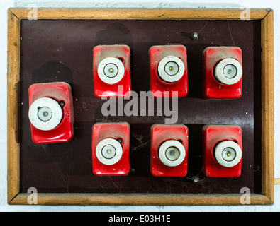 Red vintage electrical fuse. Switchboard Stock Photo